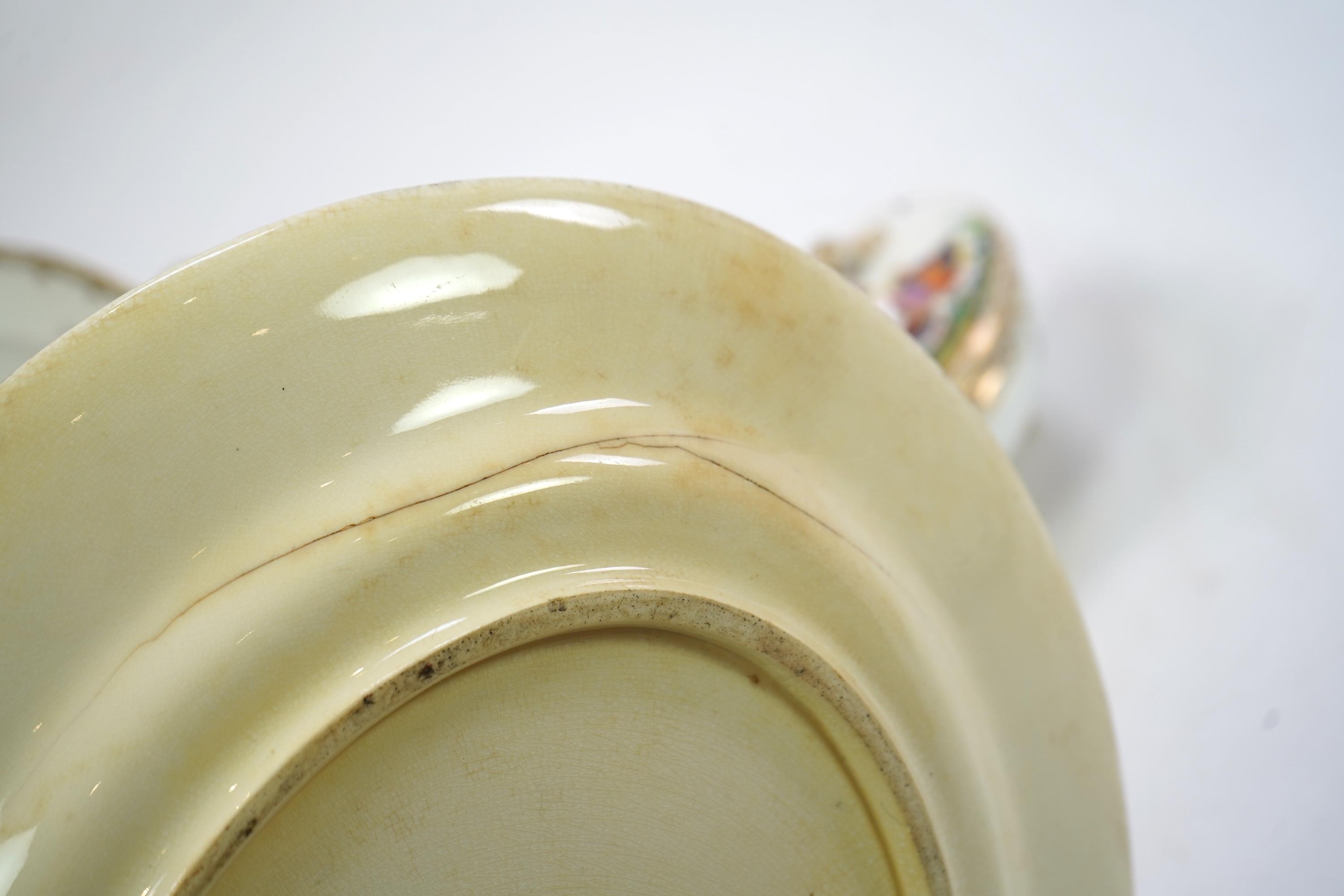 A Coalport bird painted part dinner service, mid 19th century